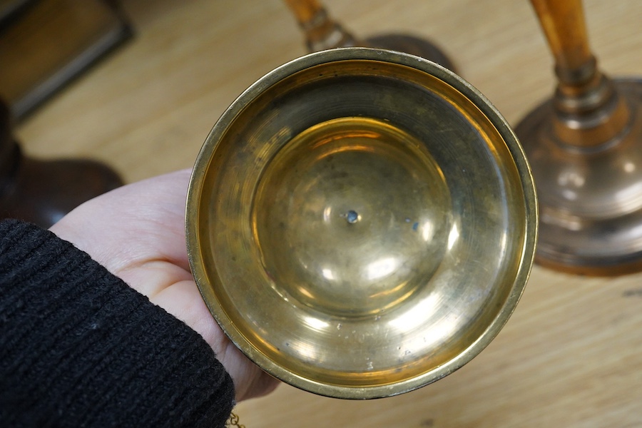 Two pairs of candlesticks to include 18th century brass ejector examples, 37cm wide. Condition - good